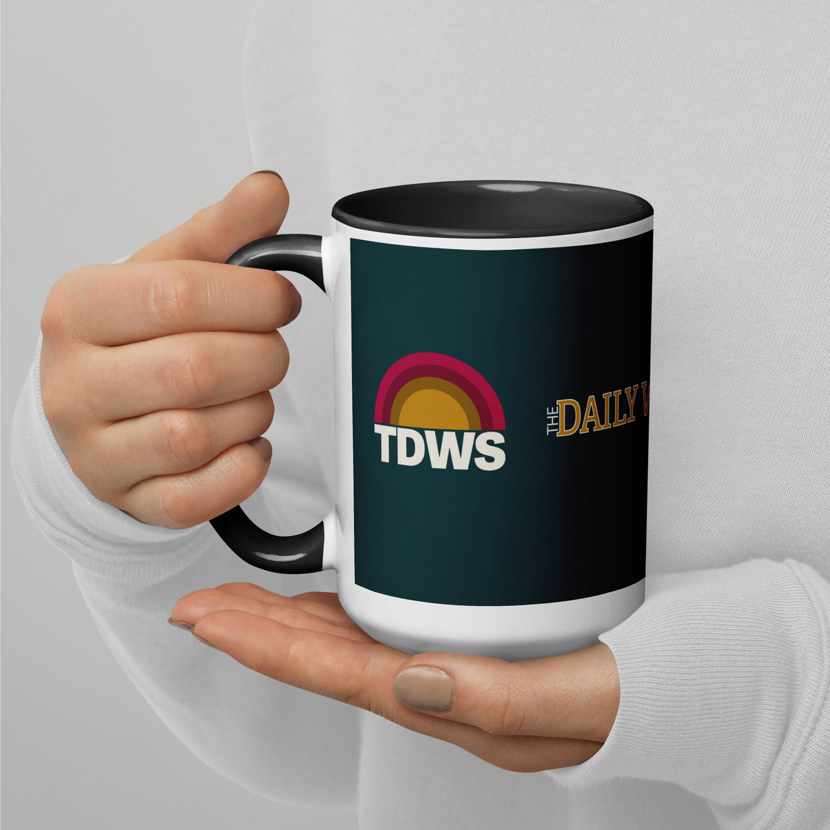 Daily Whatever Show TDWS 15 oz mug in deep teal with black inside, held in hand